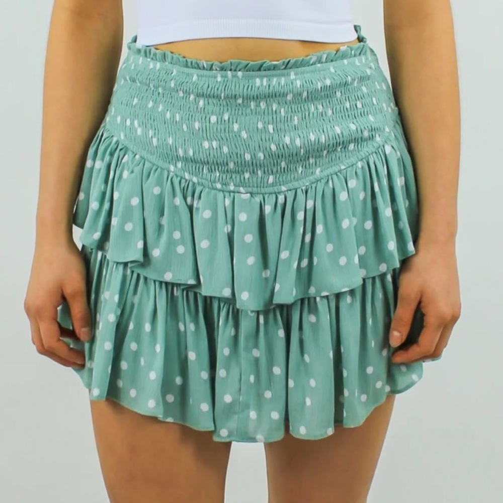 Sage green skort with white polka dots